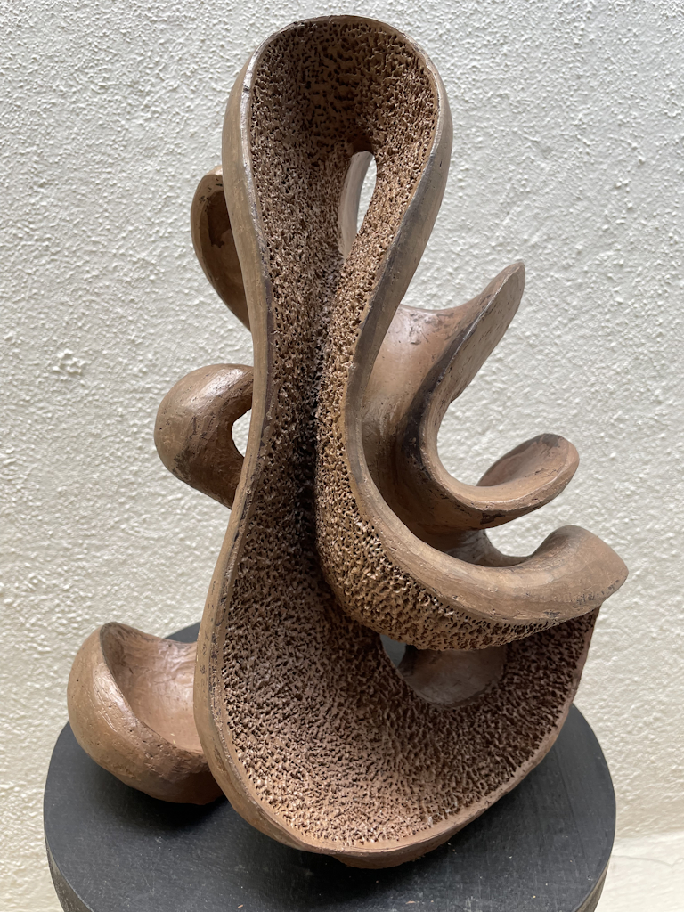 terracotta sculpture exploring the power of attraction