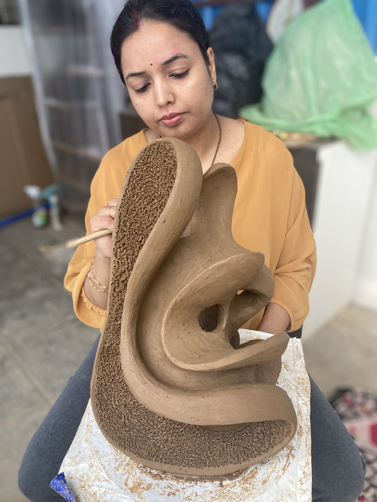 Aarti Gupta Bhadauria terracotta artwork placeholder beneath the about heading